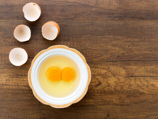 raw eggs yolk in a bowl on a table