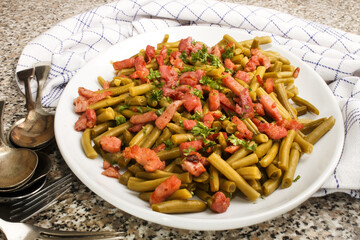 Wall Mural - green beans with fried bacon and freshly chopped parsley on a plate