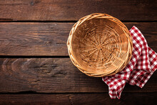 Empty Wicker Basket On A Wooden Background, Top View