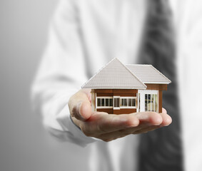 Home insurance concept in hand