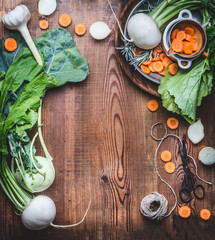 Wall Mural - Vegetarian food background with fresh  organic local vegetables on wooden rustic kitchen table, top view, cooking preparation. Healthy food , vegan and clean diet eating concept