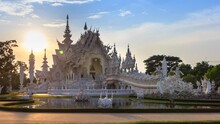 Wat Rong Khun Beautiful White Temple Landmark Travel Place Of Chiang Rai, Thailand 4K Time Lapse Sunset (zoom Out)