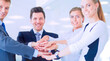 © lenets_tan - Business people with their hands together in a circle