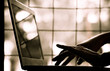 silhouette black and white of anonymous hacker typing on keyboard of laptop for remotely hacking and receiving personal information near window, Payment Security Concept