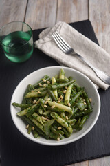 Wall Mural - Pasta with vegetables, pesto, and pine nuts