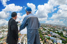 Cityscape Bird Eye View Asian Business Manager Discussing With Engineer For Planning Construction City View With Blue Sky, Bangkok Thailand.with Blue Sky, Bangkok Thailand.