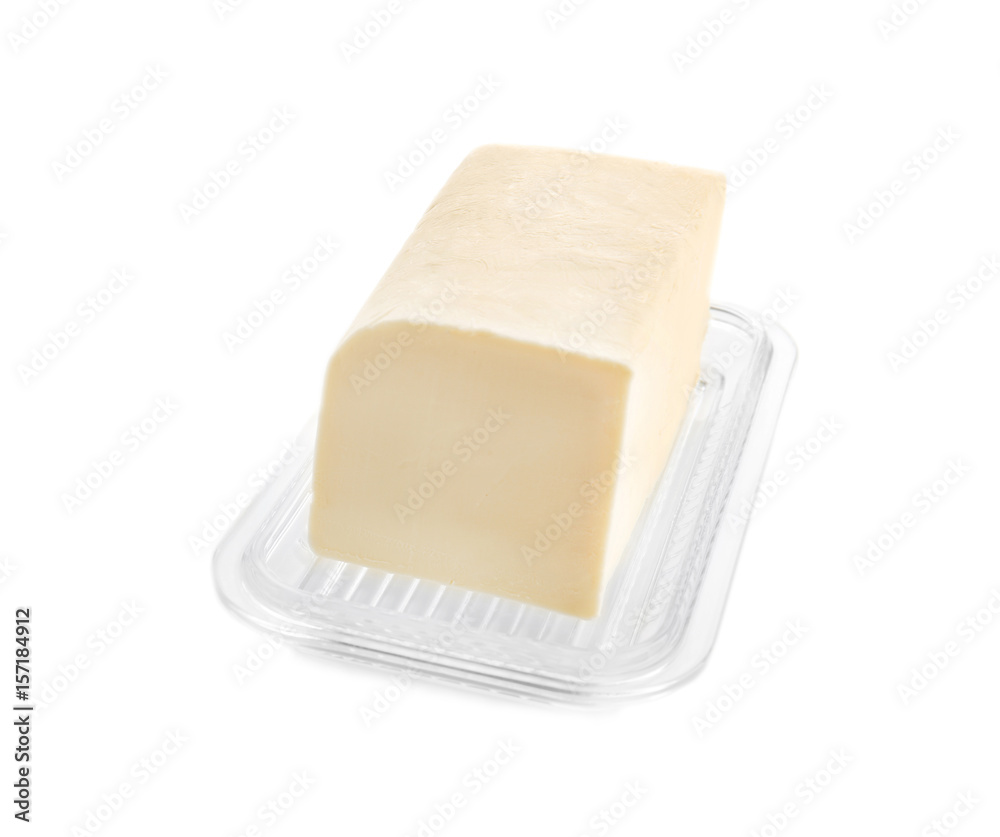 Dish with butter on white background