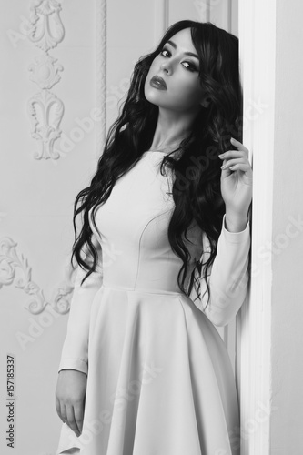 Pretty Sensaul Elegant Girl With Long Curly Black Hair Standing