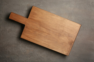 Canvas Print - Wooden cutting board on gray background