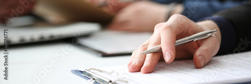 Fotografía Hand of businessman signing document with pen