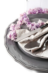 Wall Mural - Beautiful festive table setting with lilac flower decor on white background, closeup