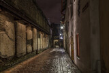 Fototapeta Uliczki - Medieval street at night. Historical center of Tallinn, Estonia,