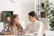 © Africa Studio - Young female psychologist working with teenager girl in office