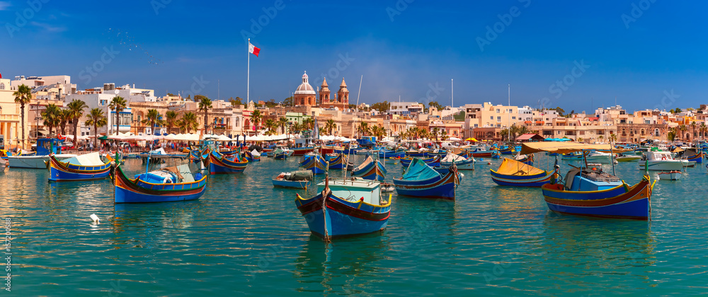 Panorama with raditional eyed colorful boats Luzzu in the Harbor of Mediterranean fishing village Marsaxlokk, Malta - obrazy, fototapety, plakaty 