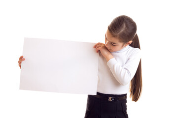 little girl holding white banner