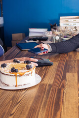 Wall Mural - cake with blueberry spoon on wooden background