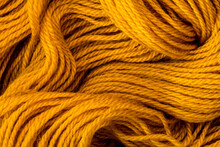 Close Up The Golden Yellow Yarn Thread As Abstract  Background