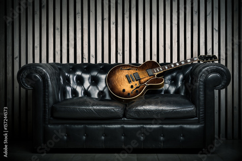 Empty Vintage Sofa And Electric Guitar With Modern Wood Wall Recording Studio Background Music Concept With Nobody Buy This Stock Photo And Explore Similar Images At Adobe Stock Adobe Stock