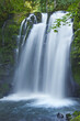 Closeup of Majestic Falls waterfall cascading over mossy rocks in McDowell Park, Oregon