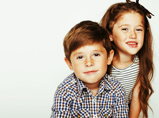 little cute boy and girl hugging playing on white background, ha