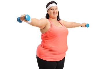 Wall Mural - Overweight woman lifting dumbbells