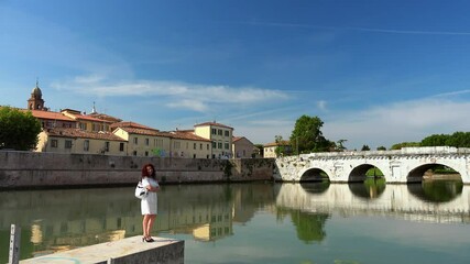 Canvas Print - lady in front of ancient Roman bridge