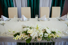 Festive Table Setting In The Restaurant With Flowers. Wedding Decor.
