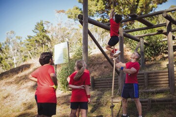 Wall Mural - trainer instructing kids in the boot camp