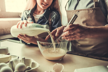 Grandma and granddaughter in kitchen