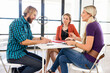© Sergey Nivens - Young office workers discussing