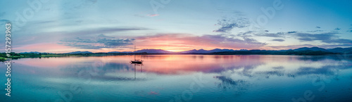Cuadros en Lienzo Aerial of an amazing sunset with sailing vessel Loch Creran, Barcaldine, Argyll