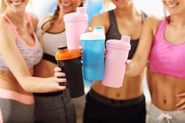 Canvas Print - Young women group resting at the gym after workout