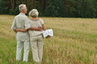 © aletia2011 - Senior couple on mowed field of wheat