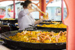 Seafood paella sold at street market stand