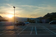 Rooftop outdoor parking lot against sunset