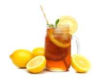 Mason Jar Glass Of Iced Tea With Lemons And Straw Isolated On A White Background