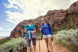 © Brocreative - Women hiking together in a beautiful red rock canyon
