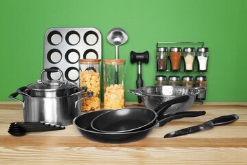 Kitchen utensils and cookware for cooking classes on wooden table