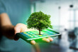 © Production Perig - Green tree going out of a smartphone - Ecology concept