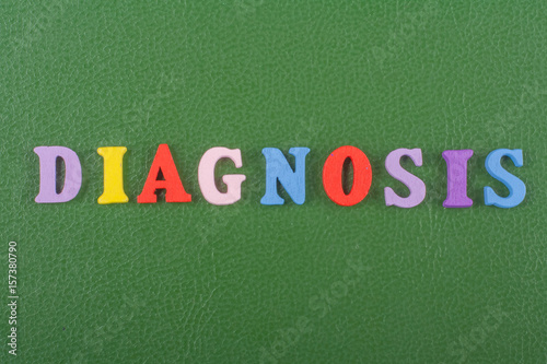 Fotografía DIAGNOSIS word on green background composed from colorful abc alphabet block wooden letters, copy space for ad text