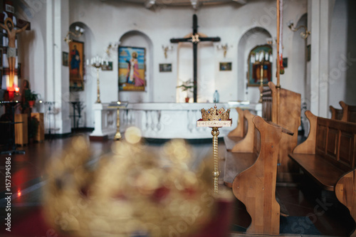 Wooden Benches Stand In A White Church Before A Cross Buy This