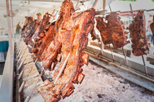Roasted Meat Of Beef Cooking. Asado Is Traditional Argentine Dish.