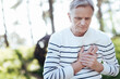 © zinkevych - Overwhelmed pensioner suffering from heart attack outdoors