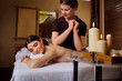 © Studio Romantic - Masseur girl doing massage to woman in spa salon.
