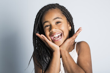 Wall Mural - Adorable african little girl on studio gray background