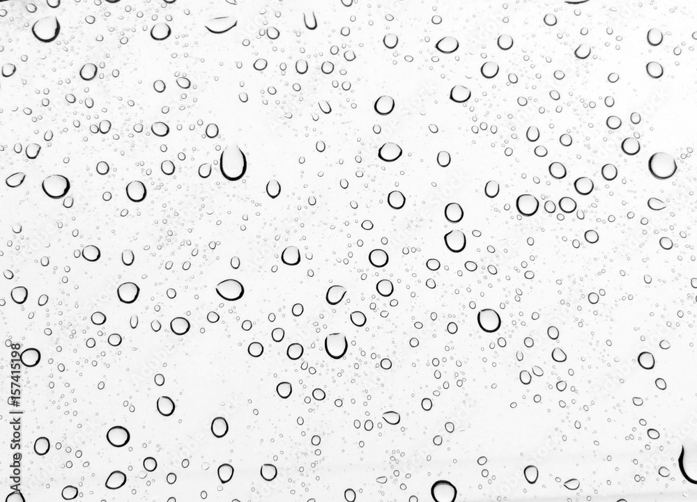 Raindrops water drop on window glass white background Stock Photo