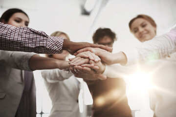 Poster - happy business team with hands on top at office