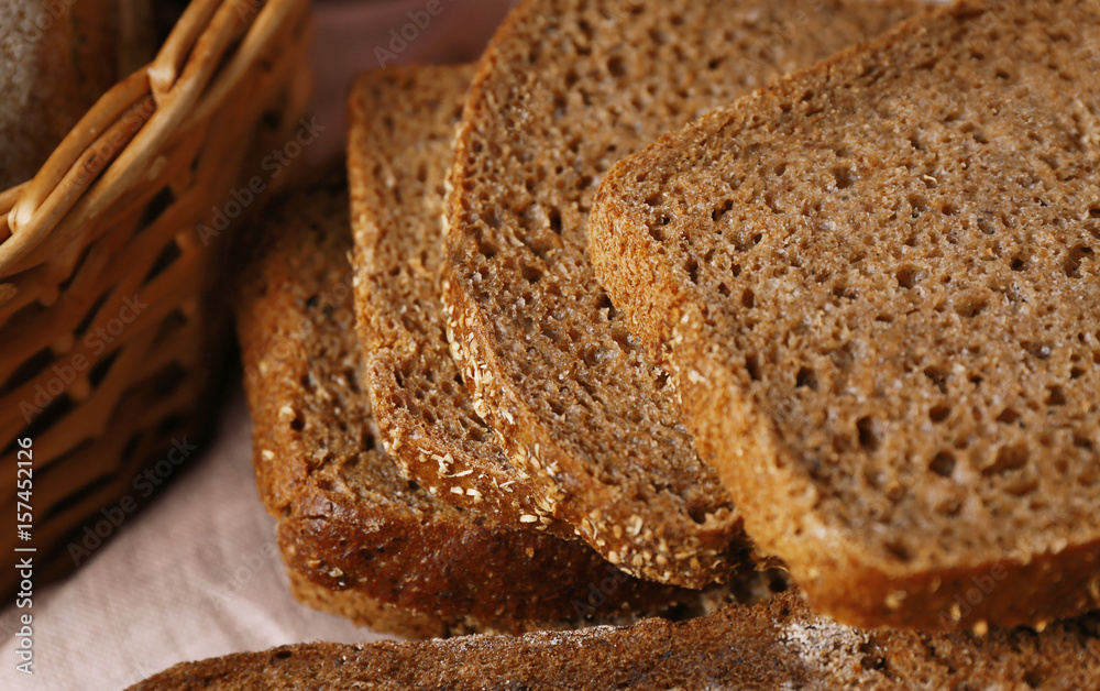 Delicious sliced rye bread on table, closeup