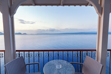 Cafe Bar Terrace, View At Mediterranean Sea. Evening Scenery, Ormos Navarinou Harbor, Pilos Town, Greece.