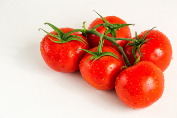 Red fresh tomatoes isolated on white background